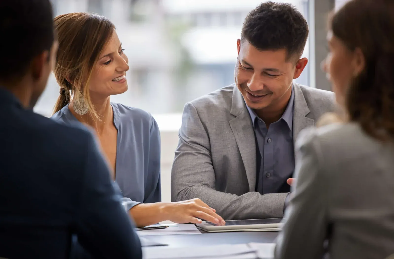 Benefits advisors meeting with a client